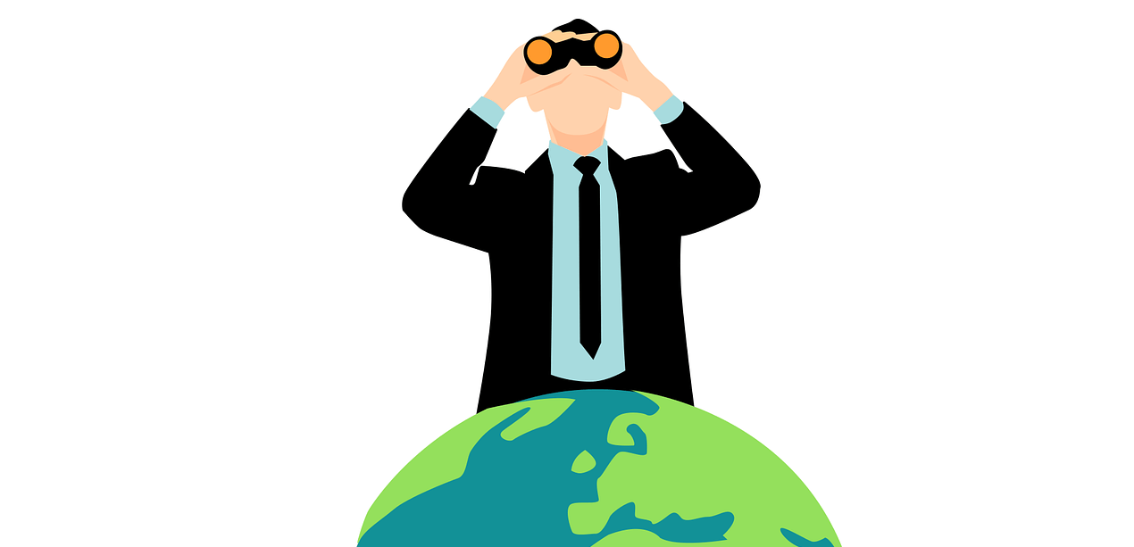A person in a suit and tie sits atop a globe, peering through binoculars