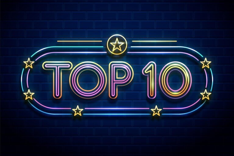 Top 10 colourful neon light sign on dark blue background.