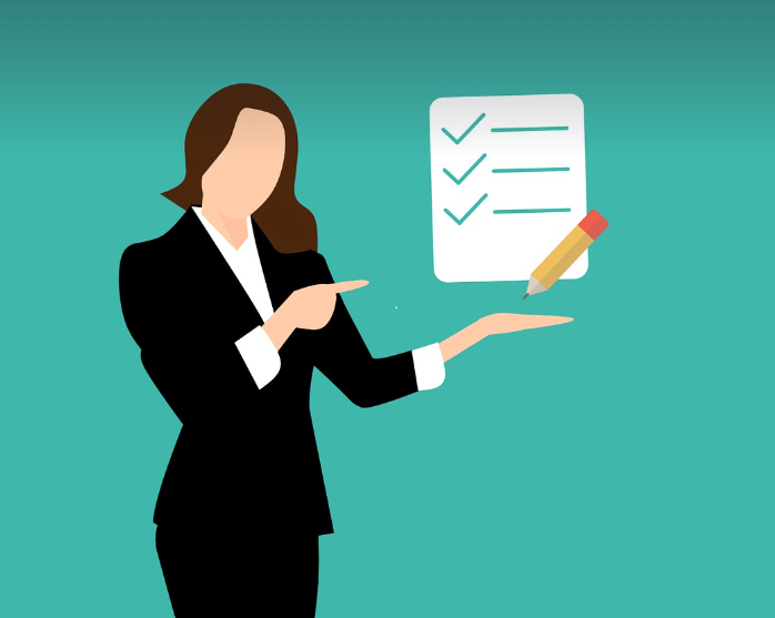 icon-style lady with long brown hair and wearing a black suit pointing at a check-list. This is to represent: the list of Best Practices Accessibility Document Design